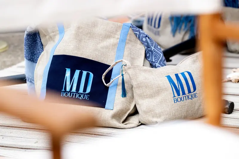 Borse e pochette in tessuto con il logo MD Boutique